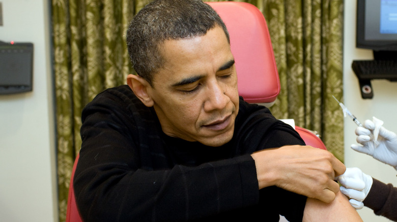 President Barack Obama gets a flu shot vaccination