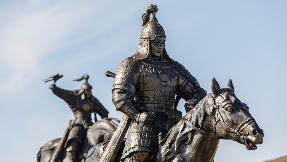 mongol warrior statues with blue sky