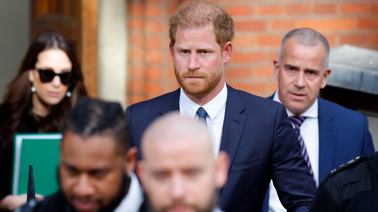 Prince Harry suit with bodyguards