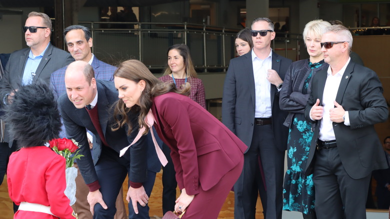 Prince William and Princess Catherine with Secret Service agents