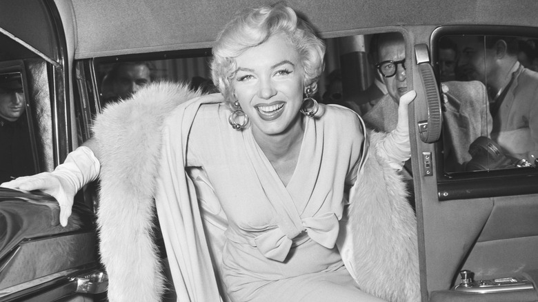 Marilyn Monroe getting into a car