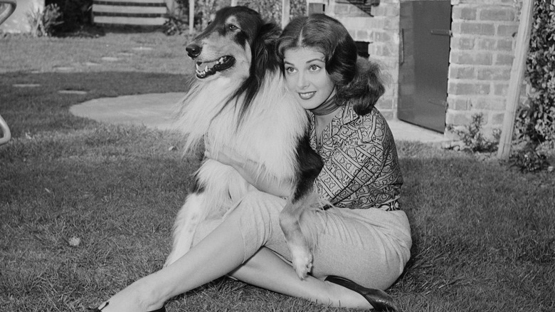 Pier Angeli sitting outside with her dog