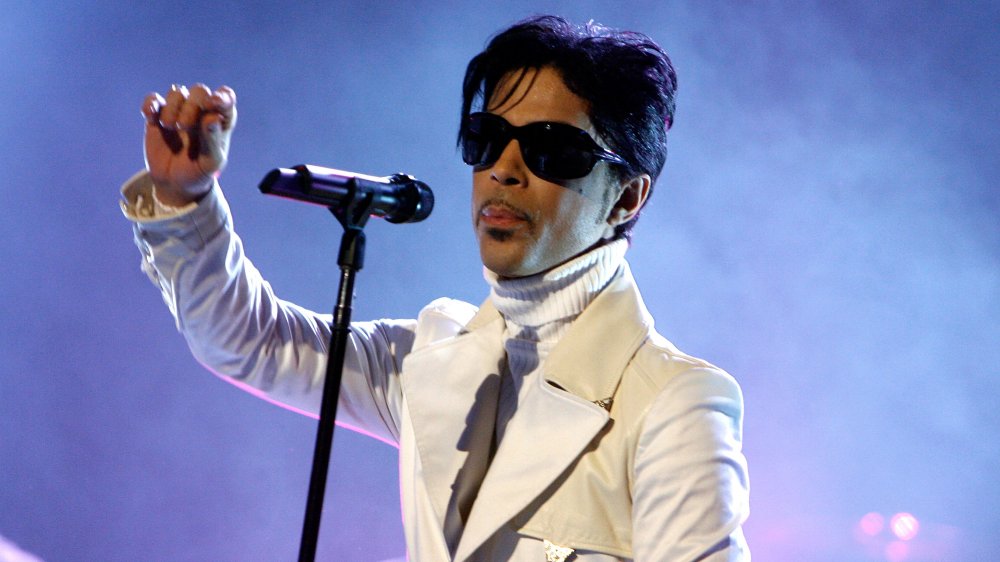 Prince on stage with sunglasses