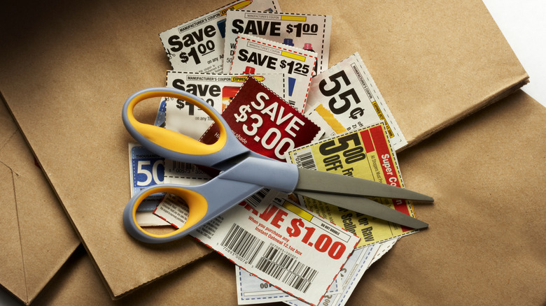 grocery coupons with red scissors