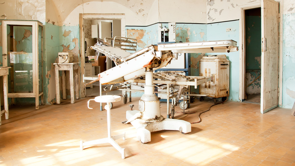 vintage operating room with rusted operating table