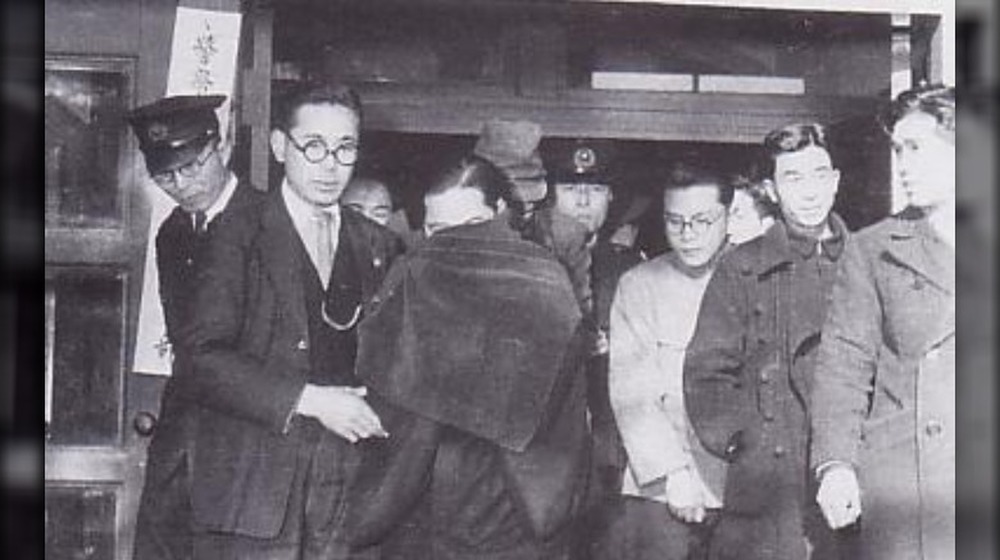 Miyuki Ishikawa being led out of court