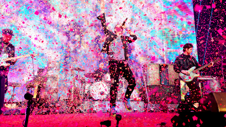 Coldplay on stage with confetti 
