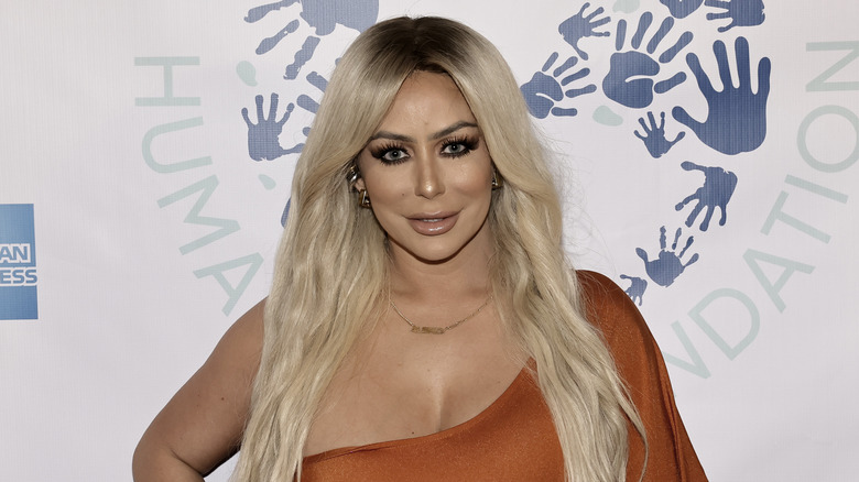 Aubrey O'Day posing during an event