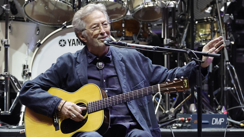 Eric Clapton on stage with acoustic guitar