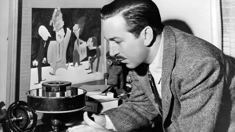 Walt Disney tinkering with a zoetrope.