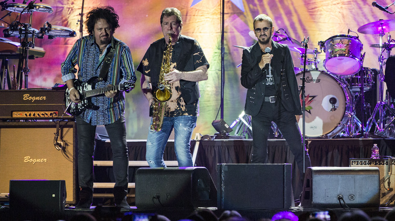 Steve Lukather, Warren Ham, and Ringo Starr on stage