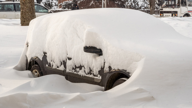 a car buried in snow