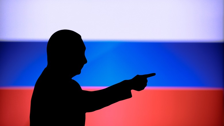 Putin silhouette against flag