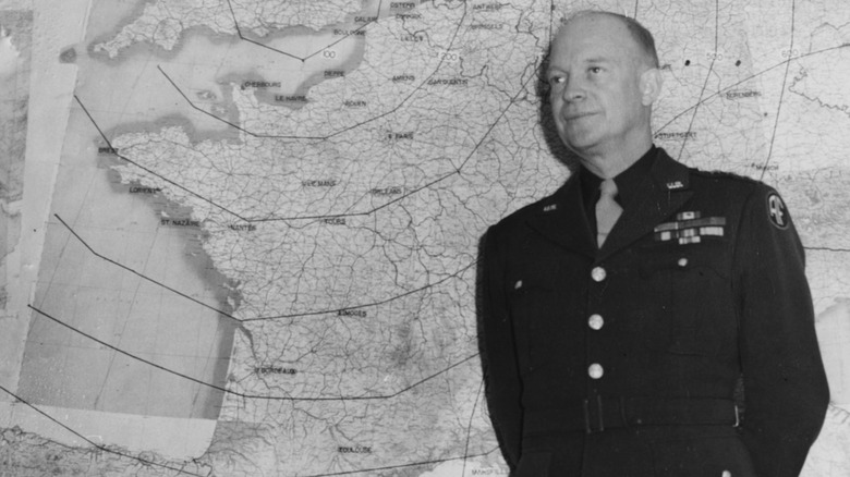 Eisenhower standing in front of map