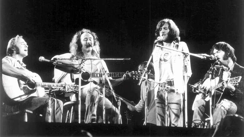 Crosby, Stills, Nash and Young performing on stage