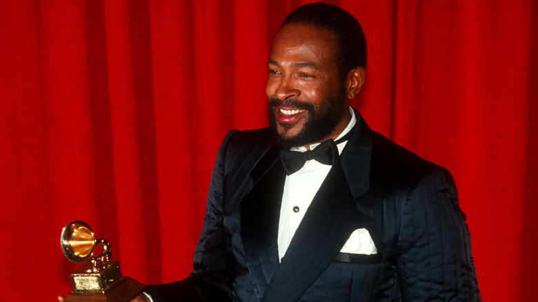 Marvin Gaye poses with his Grammy award, 1983