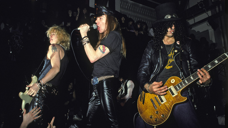 Duff, Axl and Slash of Guns N' Roses perform onstage