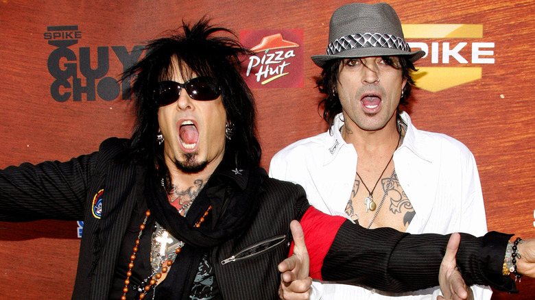 Nikki Sixx and Tommy Lee at an event  open mouths