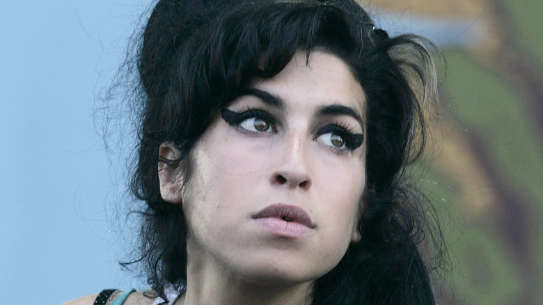 Amy Winehouse in white tank top