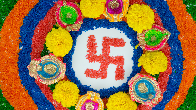 Indian flower design with swastika 