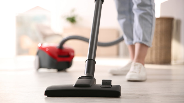 Lady using a vacuum