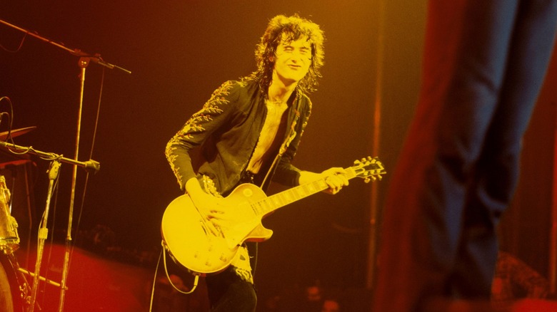 Jimmy Page playing guitar onstage MSG