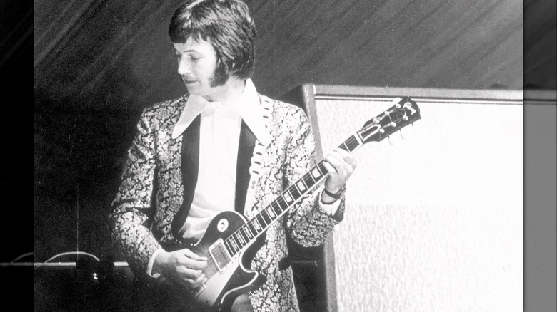 Eric Clapton playing a Les Paul onstage