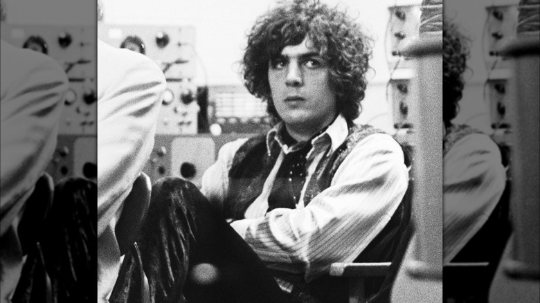 Syd Barrett sitting arms folded