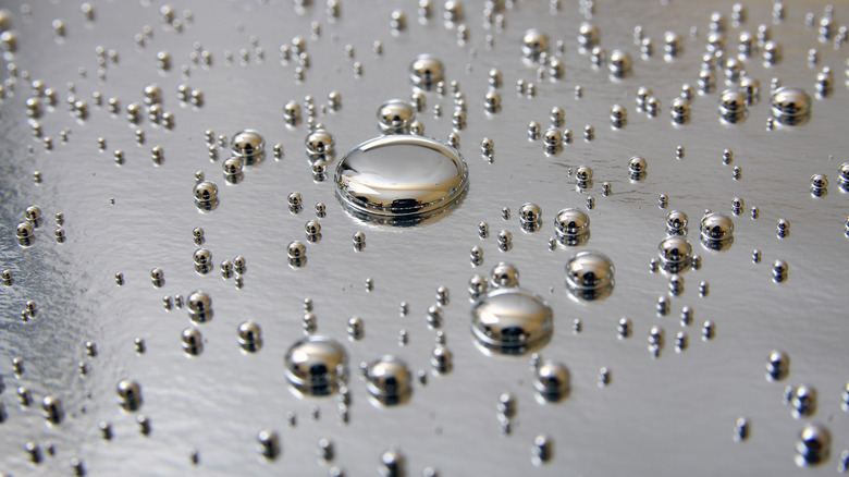Artistic representation of many liquid metal droplets