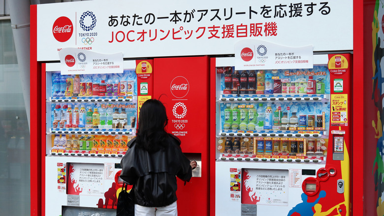 woman in front of vending machine in japan