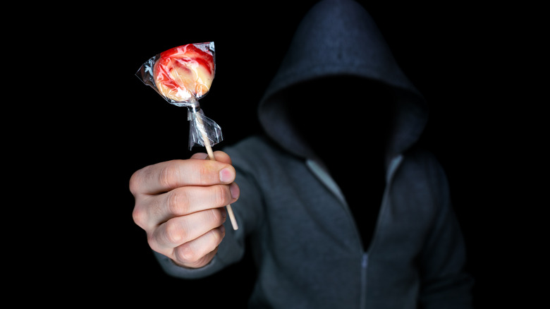 Hooded Man with candy