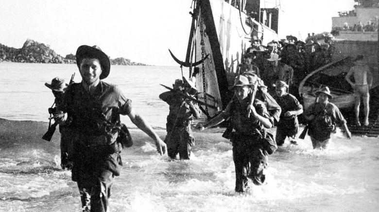 French soldiers walking through water