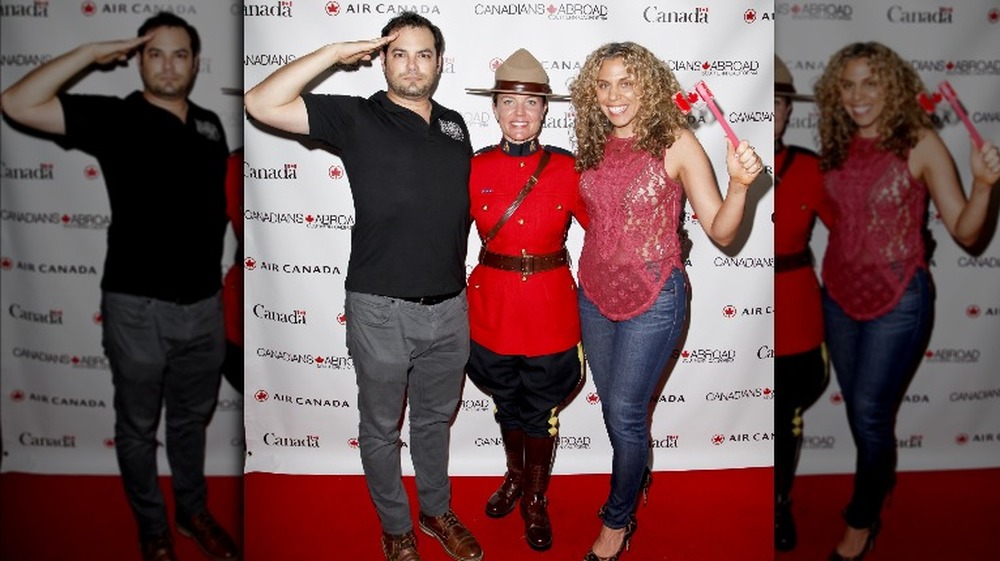 (L-R) Jamie Elman, A Canadian Mountie and Guest attend the 2017 Canada Day Celebration at Hard Rock Cafe Hollywood on July 1, 2017 in Hollywood, California.