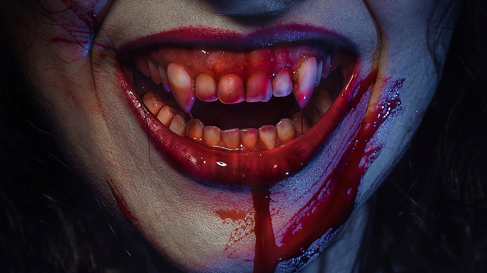 Vampire smile demon woman laughing with big fangs full of blood