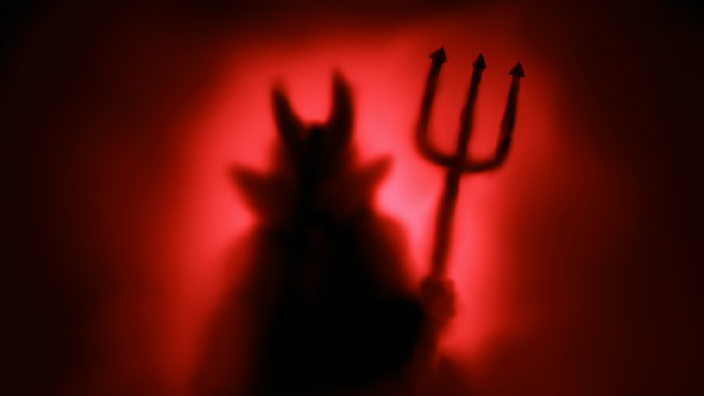 Devil silhouette with red background
