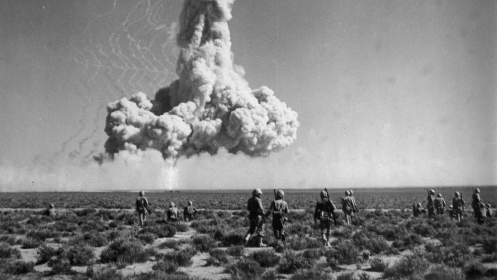 american soldiers watch atomic bomb