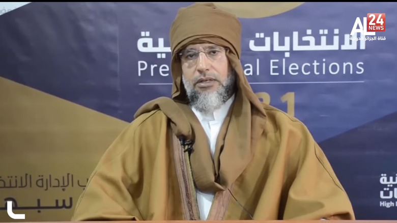Saif Gaddafi wearing brown robe