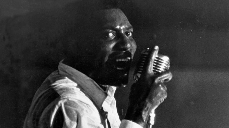 Otis Redding singing into a microphone