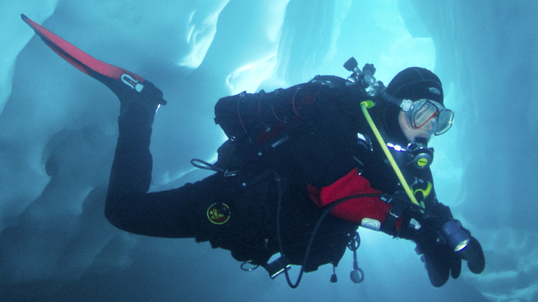 Scuba diver surrounded by ice