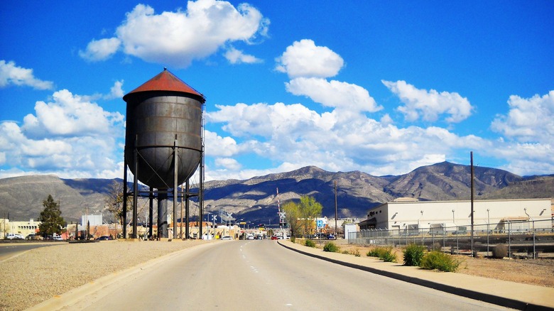 A street with a water tower in Alamogordo, New Mexico