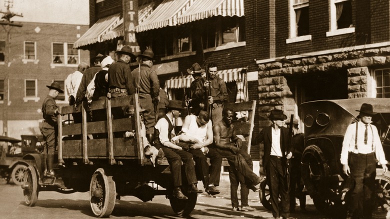 Injured Black men in a cart after the Tulsa Race Massacre