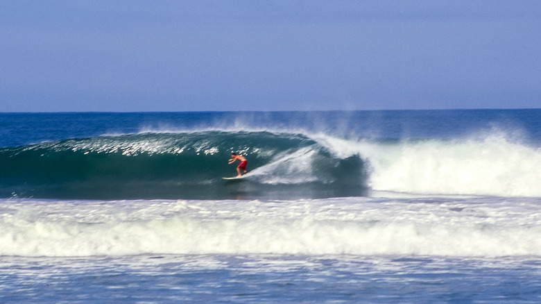man surfing wave at puerto escondido