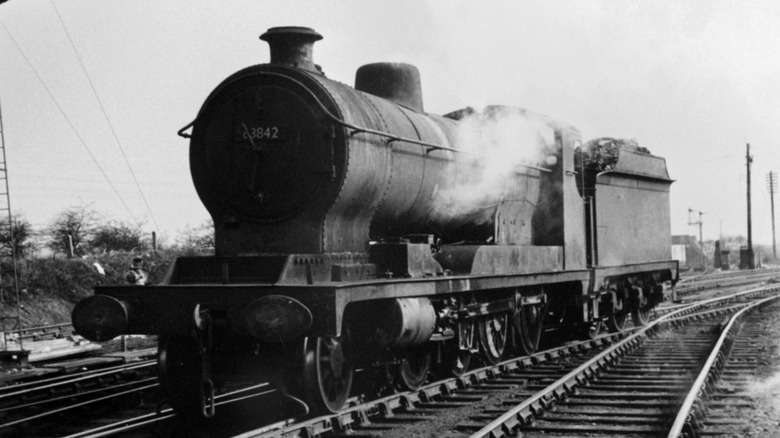 a 1917 locomotive steam on track