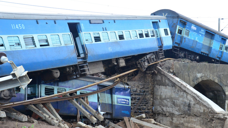 blue train cars crash