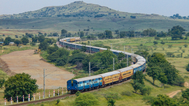 Train traveling through Indian countryside