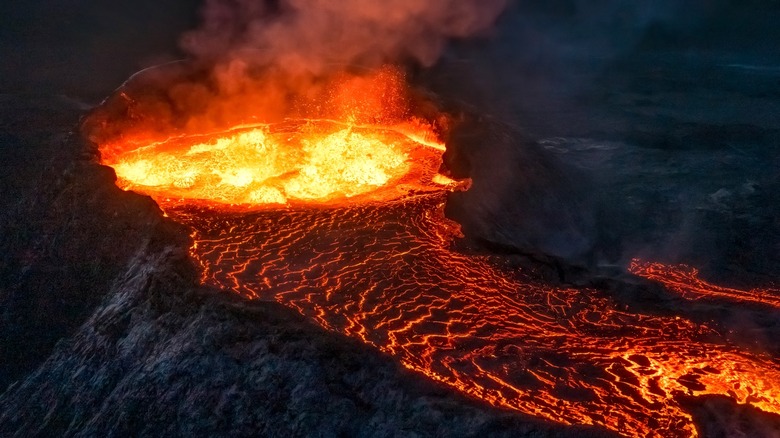 volcano lava erupting dark sky