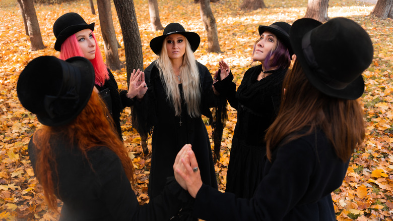 Coven of modern witches in forest