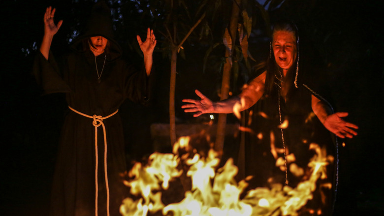 Wiccan High priestess Jussara Gabriel conjuring fire