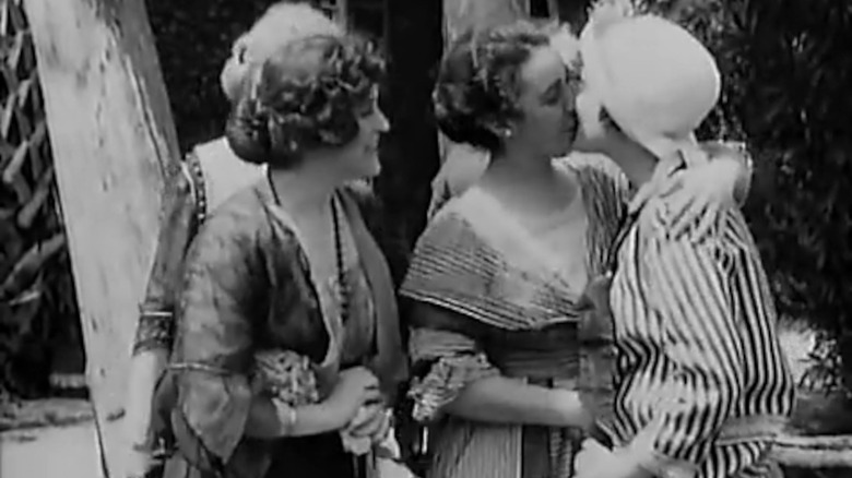 A still from the film "A Florida Enchantment" showing two women kissing