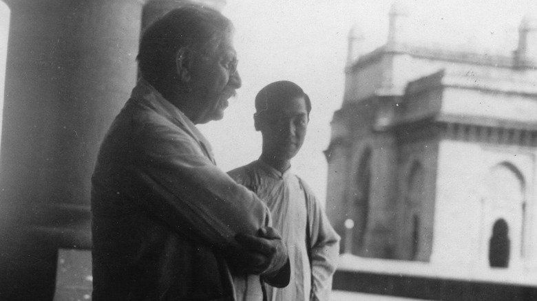 Magnus Hirschfeld in profile on a terrace with a student